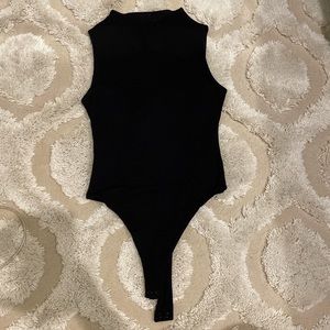 Naked wardrobe small mock neck body suit never worn